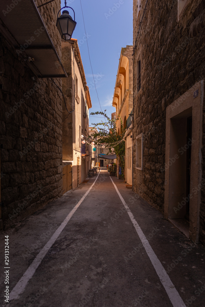 Empty narrow street in the historical centre of Porto-Vecchio, France