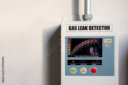 gas leak detector box on cement wall