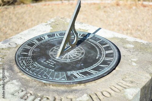 sundial in park photo
