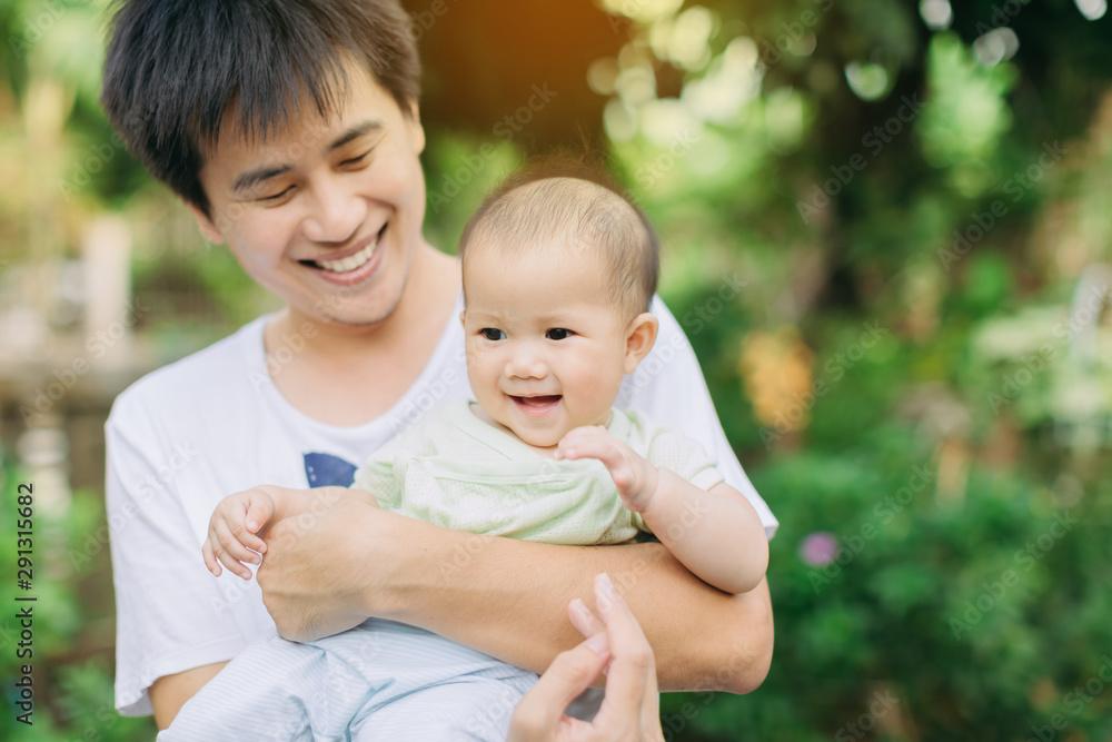 Father and baby daughter play together in a moment of happy time. Concept for father's day or child with parent and family. Father and baby daughter play together in a moment of happy time. Concept for father's day or child with parent and family.