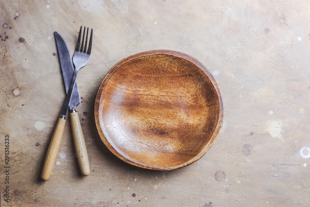 Wooden plate on beige background. Wooden plate on beige background.