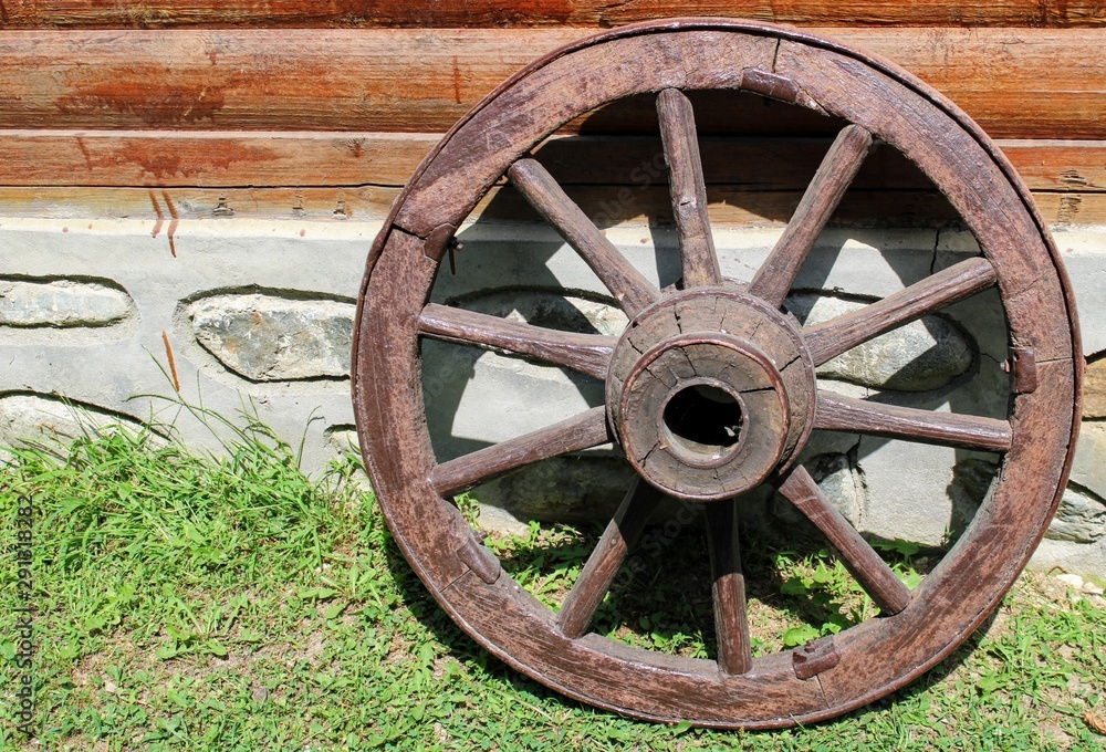 Old wooden wheel of a float