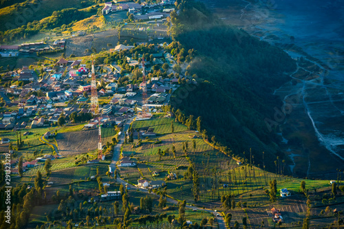 Beautiful misty morning view of Cemoro Lawang village in Bromo Tengger Semeru National Park in East Java Indonesia from Penanjakan view point.