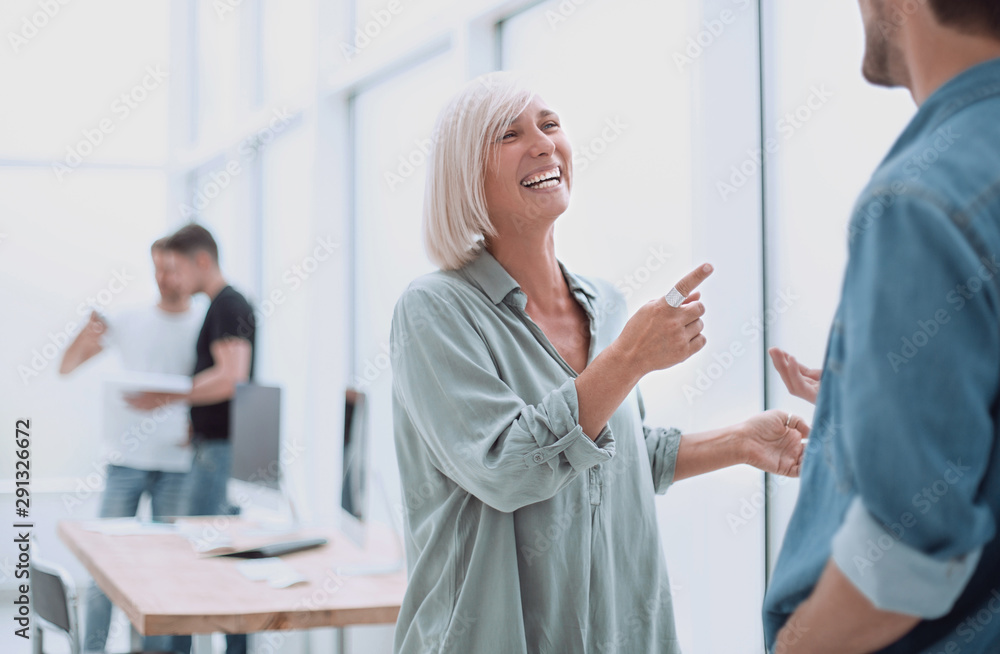 Fototapeta premium smiling businesswoman explaining something to her colleague