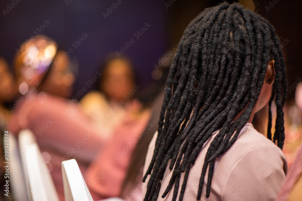 Woman with dreadlock hairstyle shot from behind Woman with dreadlock hairstyle shot from behind