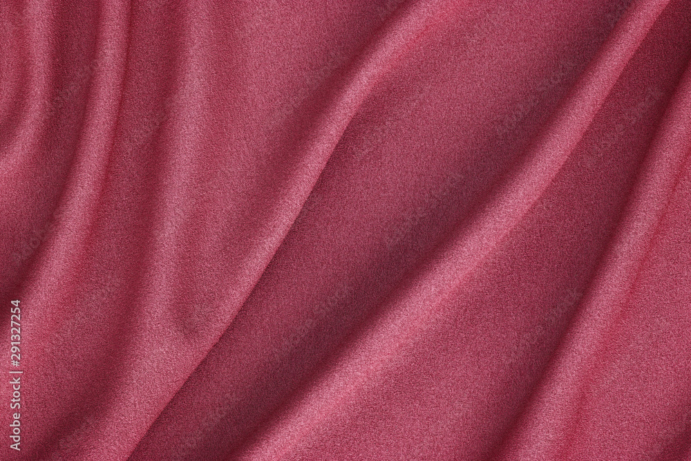 red synthetic fabric with large folds, textile background red synthetic fabric with large folds, textile background