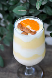 mango smoothie or mango yogurt smoothie with orange topping