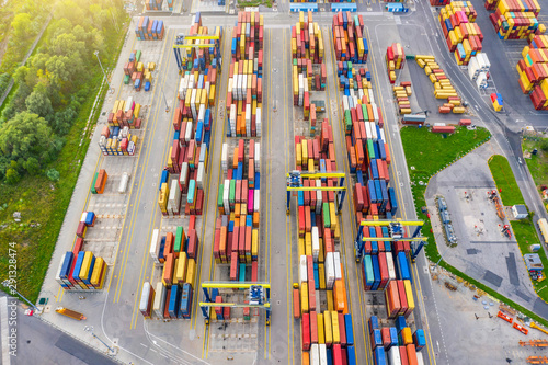 Aerial view of huge area with stacked cargo containers at the port.