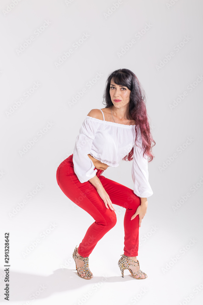 Latina dance, strip dance, contemporary and bachata lady concept - Woman dancing improvisation and moving her long hair on a white background Latina dance, strip dance, contemporary and bachata lady concept - Woman dancing improvisation and moving her long hair on a white background