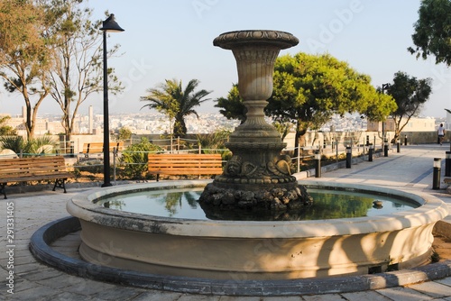 Floriana, Malta, August 2019. A magnificent old fountain in the center of the botanical garden.