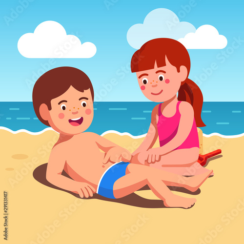 Kids boy and girl playing at sea shore beach sand