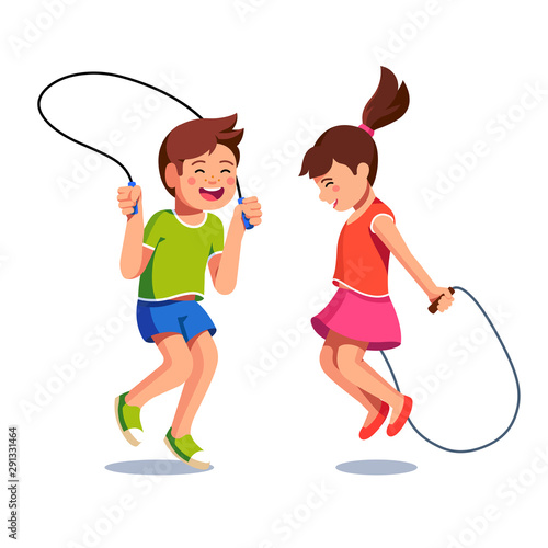 Happy boy and girl jumping up over skipping ropes