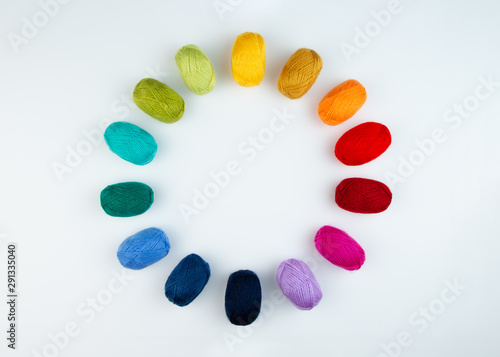 Colorful balls of wool in a circle.