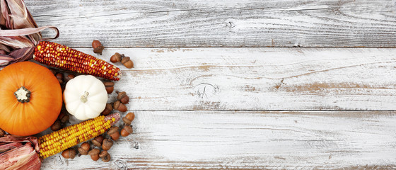Autumn decorations on white rustic wooden boards for Halloween or Thanksgiving holiday concept