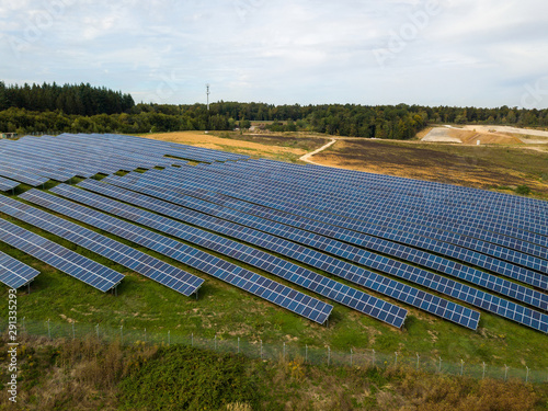Fotografie Aerial view of solar panels in solar farm built within a former dumping ground