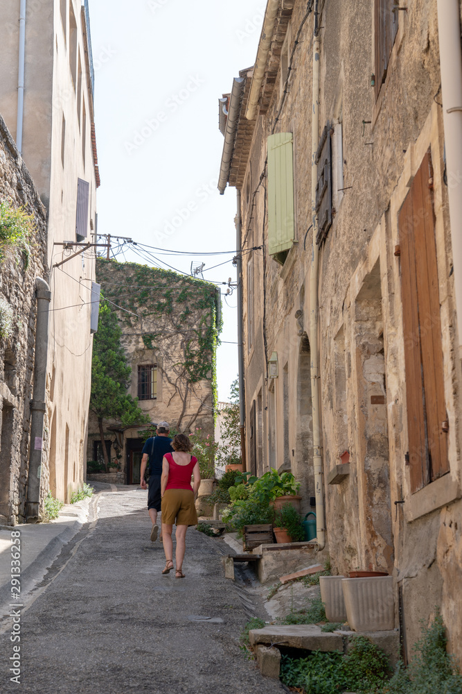 small street alley Village of Bonnieux in Provence France with tourist