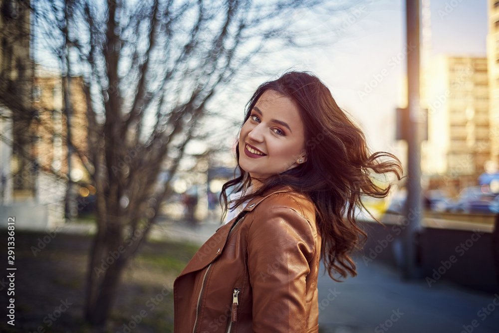 Classic beauty portrait of young woman with blue eyes and dark hair, weared in white shirt and jacket. Street shot Classic beauty portrait of young woman with blue eyes and dark hair, weared in white shirt and jacket. Street shot