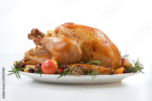 Roasted Turkey with Grab Apples over white photo