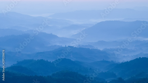mountains valley with the sea of fog and clouds.Layers of mountains in morning sunrise.