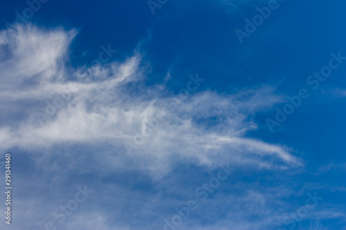 Cirrus clouds on a blue sky on a sunny day.