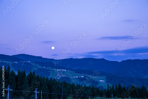 Dawn with full moon, taken from a camping field at Niigata Japan