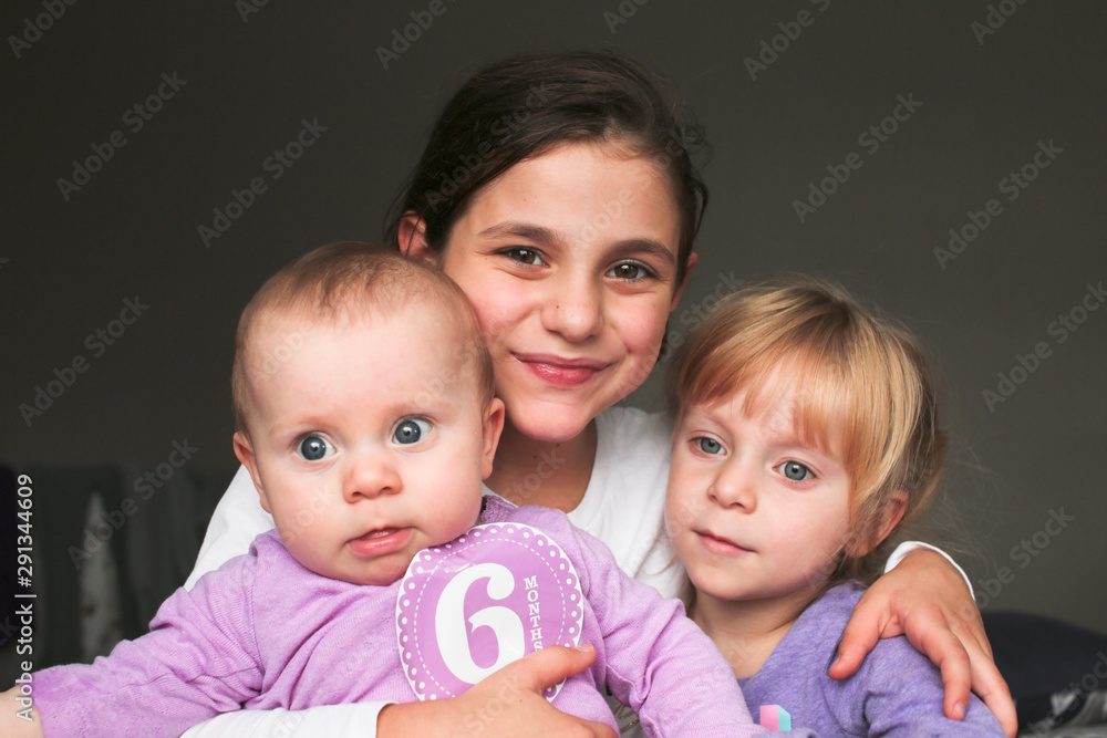 Close up Portrait of Three Beautiful Sisters, One Cute Toddler Girl , 6 Month Old Baby Girl, 7 Years Old Girl, Best Friends Forever, Happy family concept, The most Beautiful Girls, Princesses Close up Portrait of Three Beautiful Sisters, One Cute Toddler Girl , 6 Month Old Baby Girl, 7 Years Old Girl, Best Friends Forever, Happy family concept, The most Beautiful Girls, Princesses