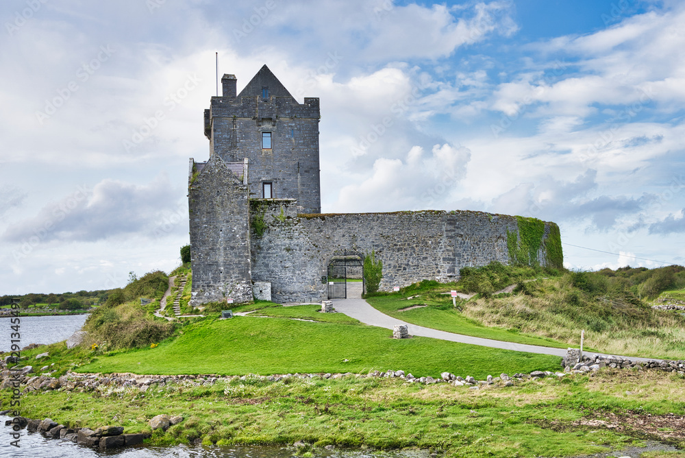 Old Irish Dunguaire Castle and cloudy sky