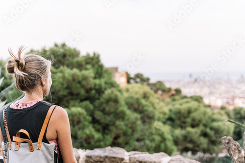 woman standing in the lookout point to see Barcelona town © carles