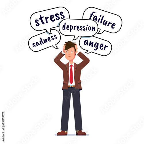 Stressed business man holding head with both hands