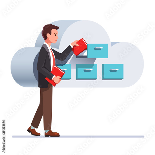 Business man putting file folders in the cabinet