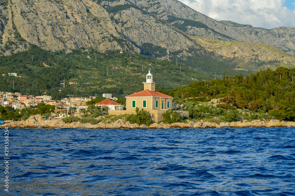 Lighthouse on Makarska riviera beach in Makarska, Croatia on June 17, 2019.