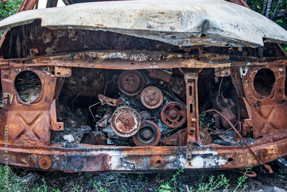 Burned car. Consequences of car accident. Damaged by arson. Machine after a fire Burned car. Consequences of car accident. Damaged by arson. Machine after a fire