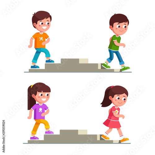 Smiling boys and girls walking up and down stairs