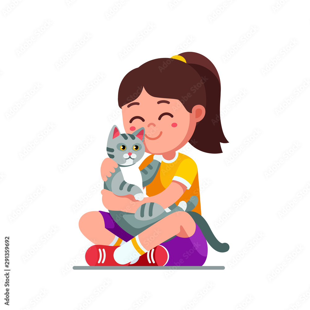 Happy preschool girl kid embracing and patting cat Happy preschool girl kid embracing and patting cat