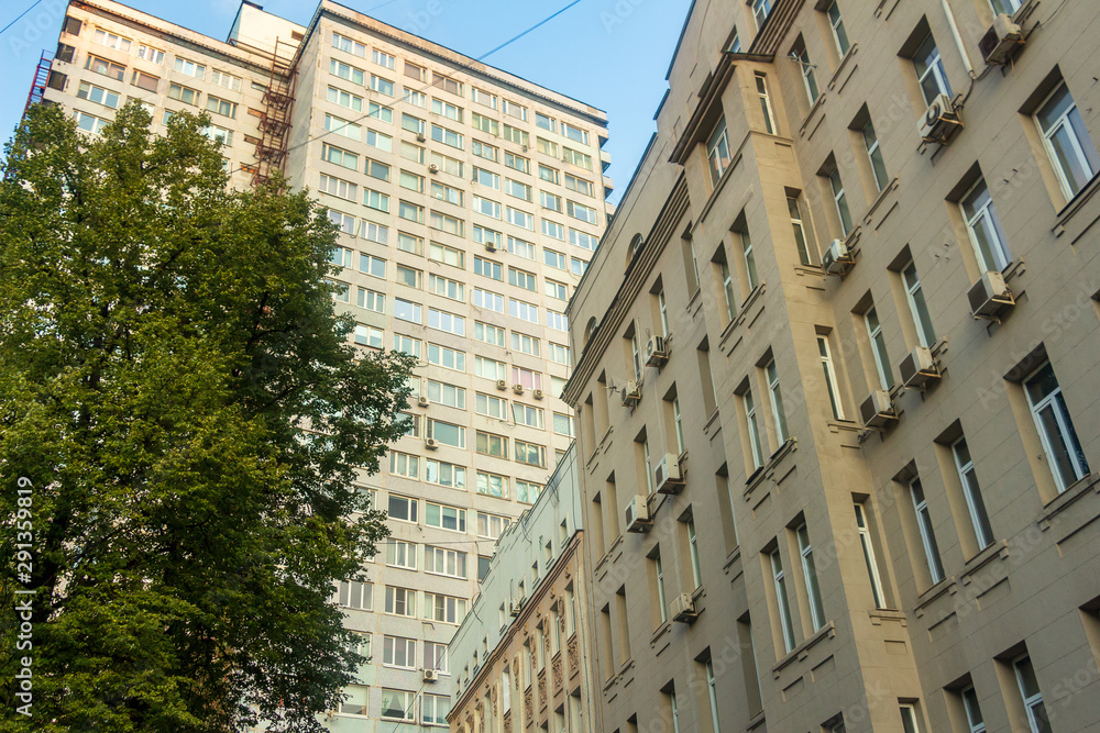 Classical and modernist buildings standing side by side. (New Arbat St., Moscow)