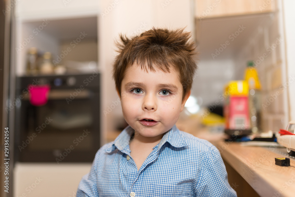Portrait of a smiling, pretty boy of several years in the children room. Portrait of a smiling, pretty boy of several years in the children room.
