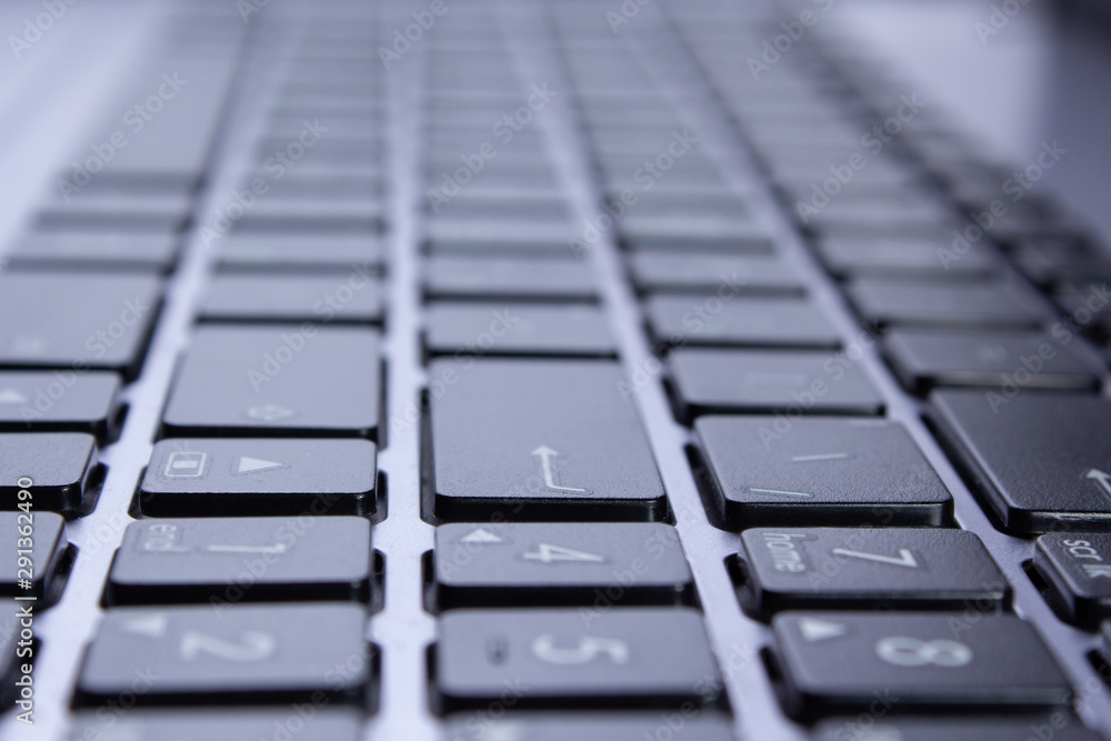 Black laptop keys close up, part of a PC