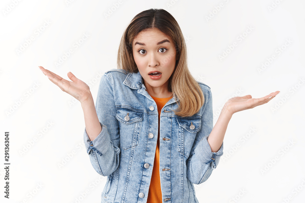I not know. Unaware clueless silly blond asian girl shrugging hands spread sideways full confusion open mouth raise eyebrows cannot answer have no idea frustrated what going on, white background I not know. Unaware clueless silly blond asian girl shrugging hands spread sideways full confusion open mouth raise eyebrows cannot answer have no idea frustrated what going on, white background