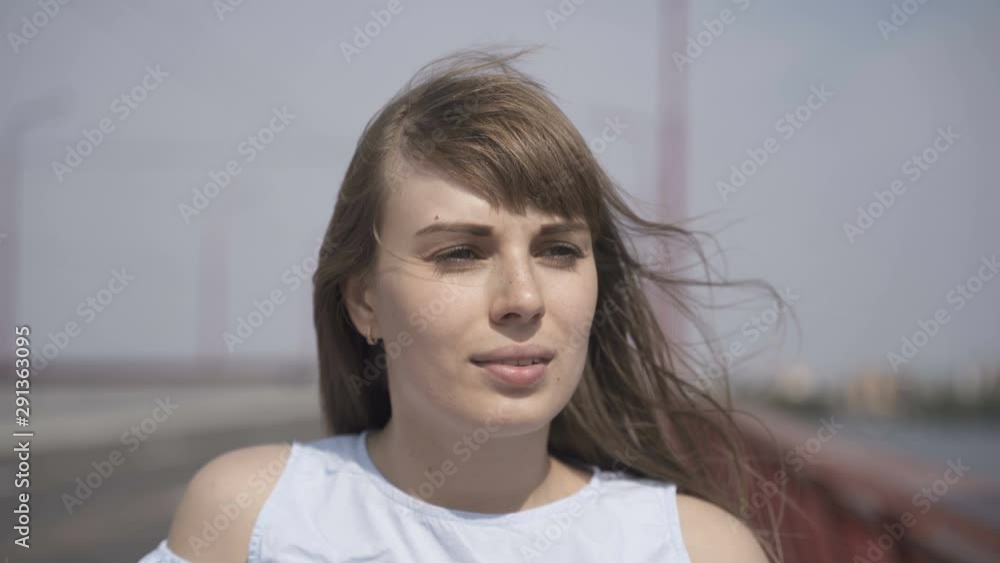 A young girl walks on a new bridge over the Dnieper River A young girl walks on a new bridge over the Dnieper River