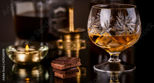 hocolate with brandy on dark background