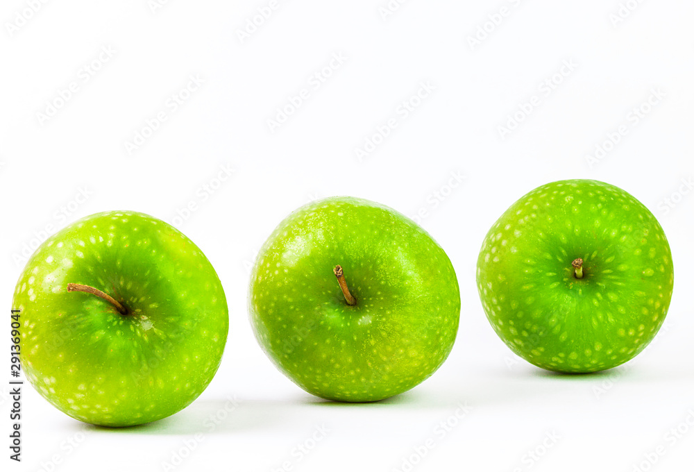 GREEN APPLES ON WHITE BACKGROUND. HEALTHY FOOD GREEN APPLES ON WHITE BACKGROUND. HEALTHY FOOD