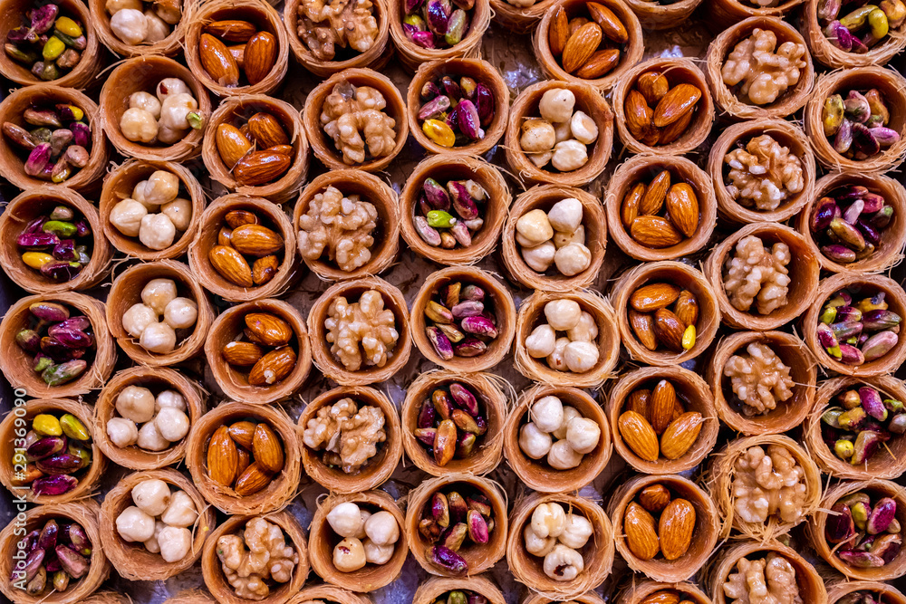 Fototapeta premium Honey baklava with nuts in the form of nests