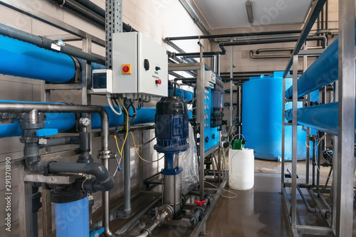 System of automatic treatment and multi-level filtration of drinking water produced from well. Plant or factory for production of purified drinking water © DedMityay