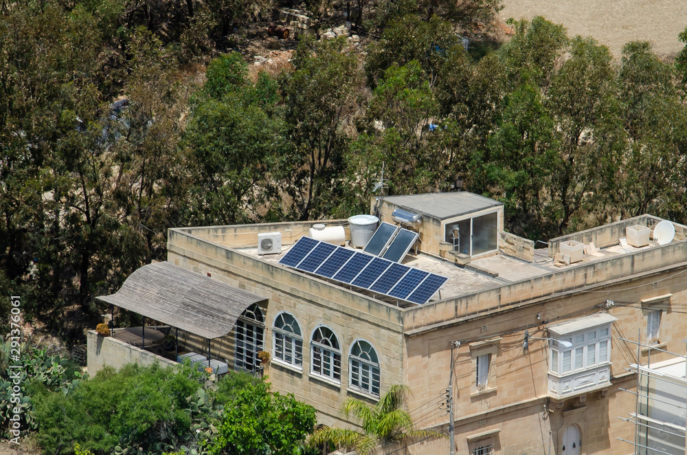 Solar panels on roof house in Gozo, Malta.