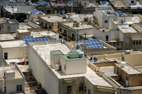Solar panels on houses in Gozo, Malta. Renewable alternative energy