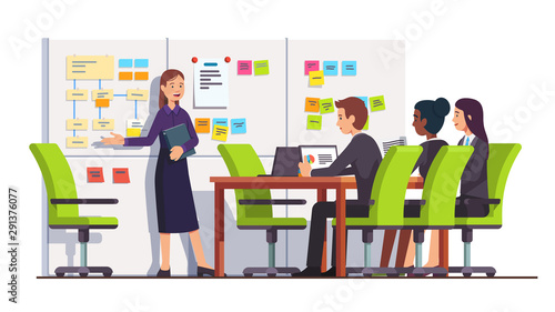 Business woman showing tasks to seminar students