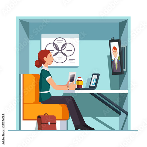 Woman worker having video call in private booth