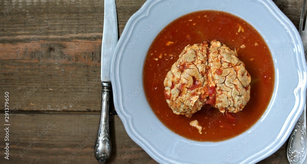 spooky halloween food. brains of a cow, sheep or calf in tomato sauce