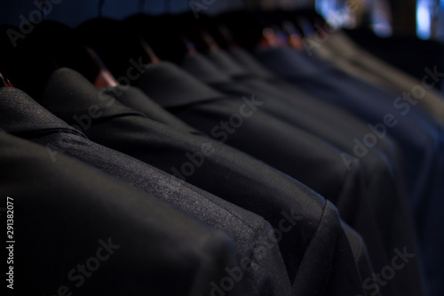 hanging suits for sale in men's store
