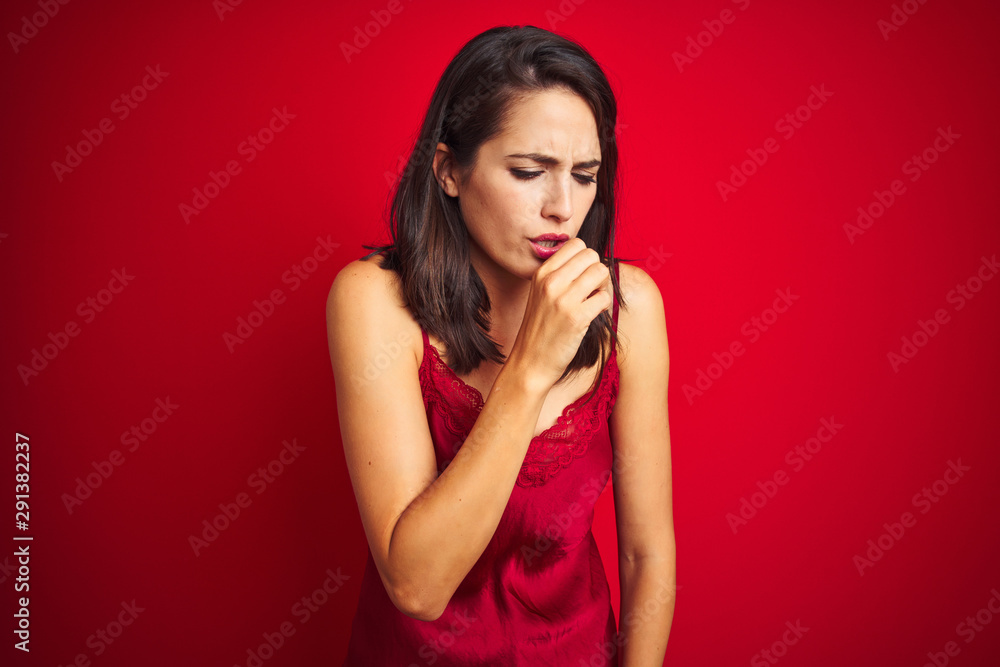 Young beautiful woman wearing sexy lingerie over red isolated background feeling unwell and coughing as symptom for cold or bronchitis. Healthcare concept. Young beautiful woman wearing sexy lingerie over red isolated background feeling unwell and coughing as symptom for cold or bronchitis. Healthcare concept.